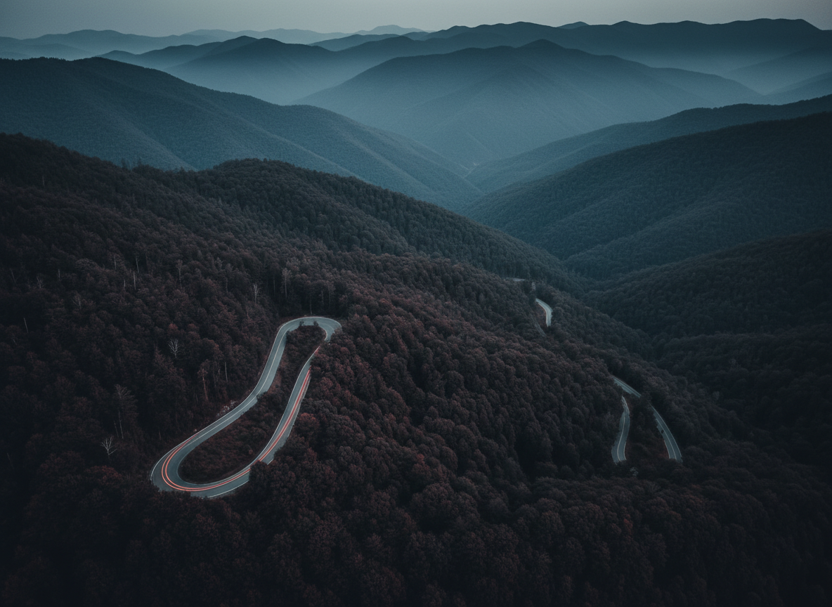Winding mountain road at dusk
